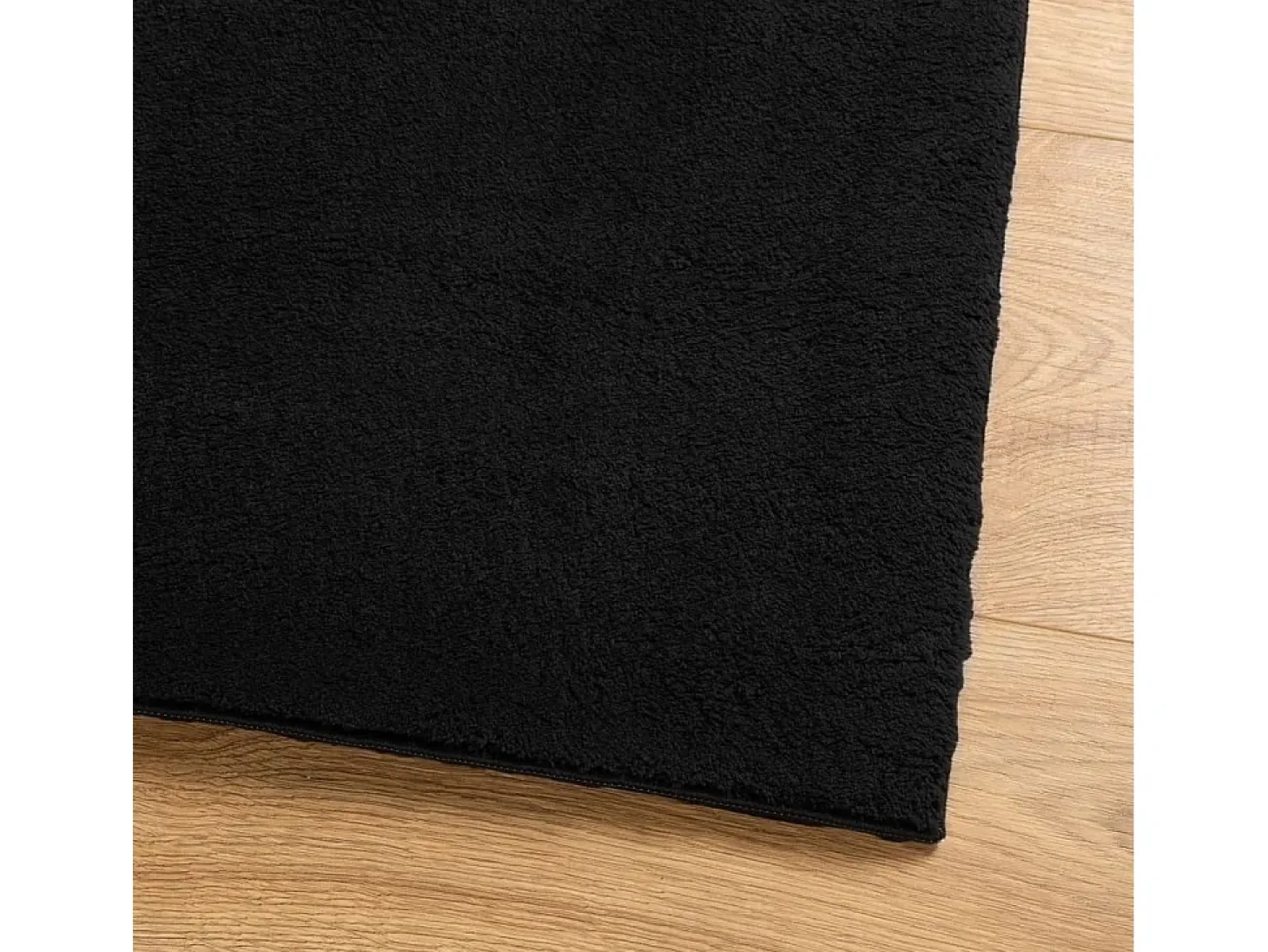 Alfombra HUARTE de pelo corto suave y lavable negra 240x340 cm