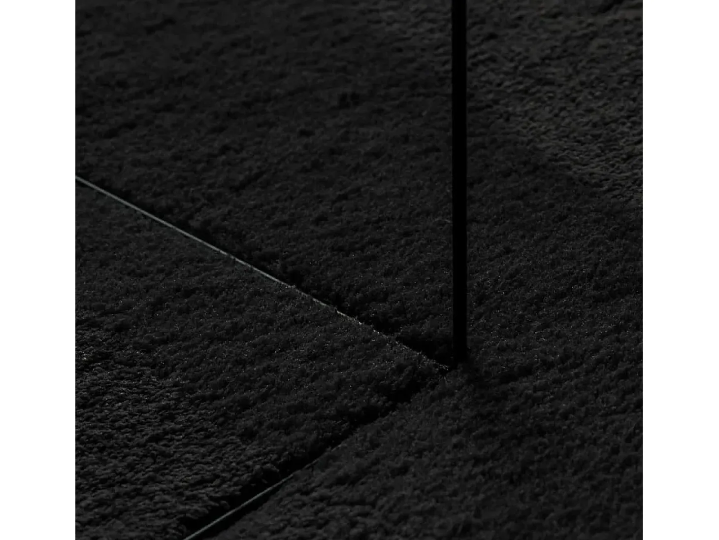 Alfombra HUARTE de pelo corto suave y lavable en color negro Ø 120 cm