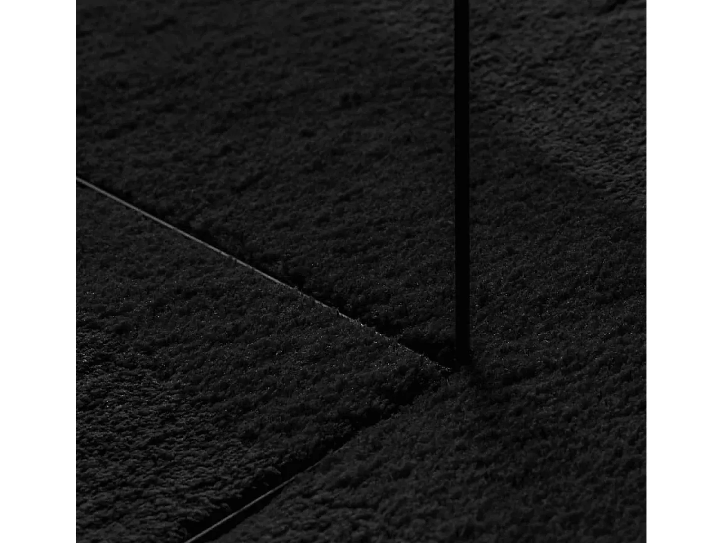 Alfombra HUARTE de pelo corto suave y lavable en color negro Ø 80 cm