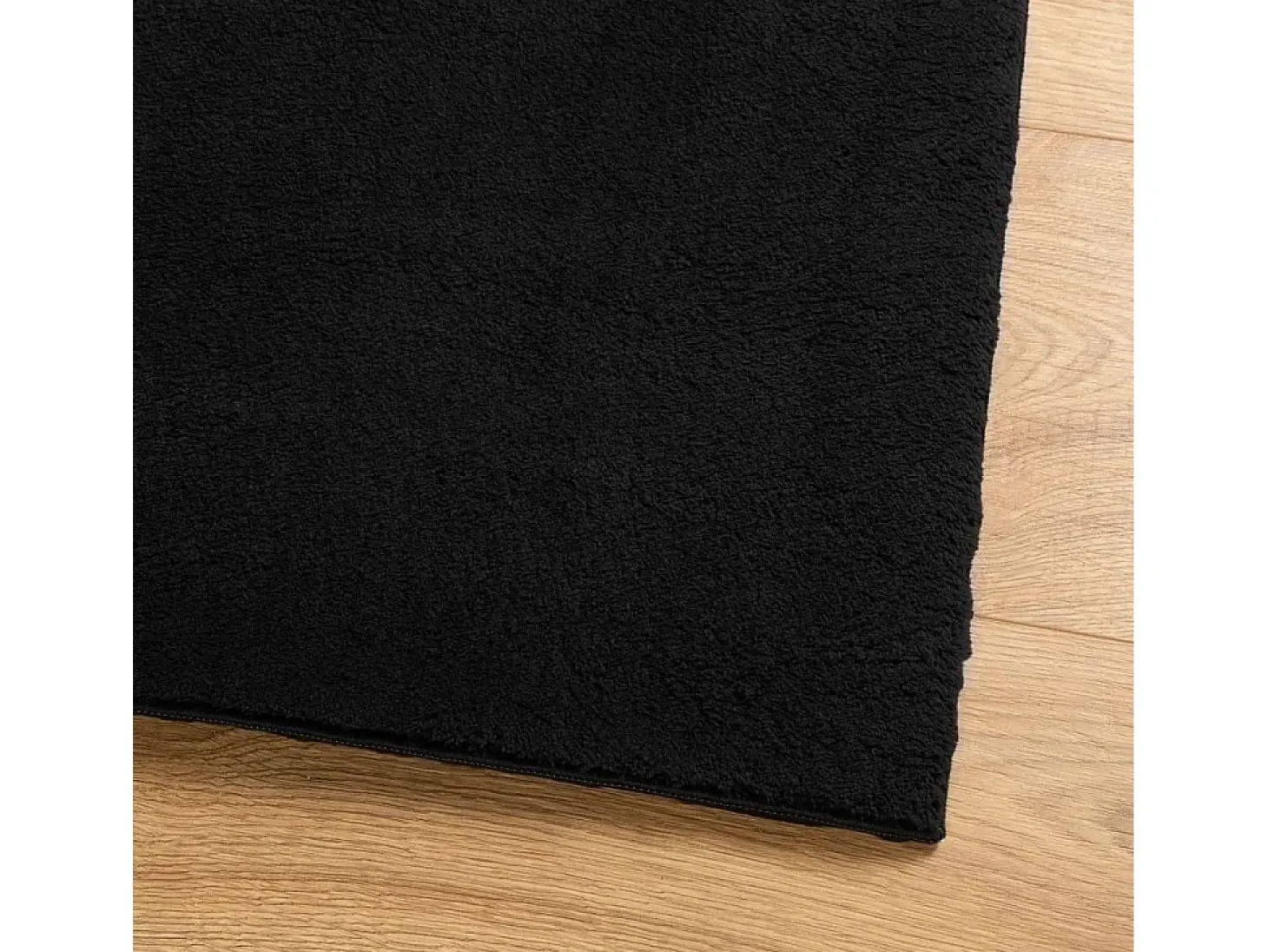 Alfombra HUARTE de pelo corto suave y lavable negra 120x170 cm