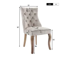 Conjunto de 4 sillas de terciopelo beige claro con patas de madera curvadas y botones decorativos.