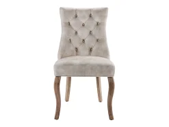 Conjunto de 6 sillas de terciopelo beige claro con patas de madera curvadas y botones decorativos.