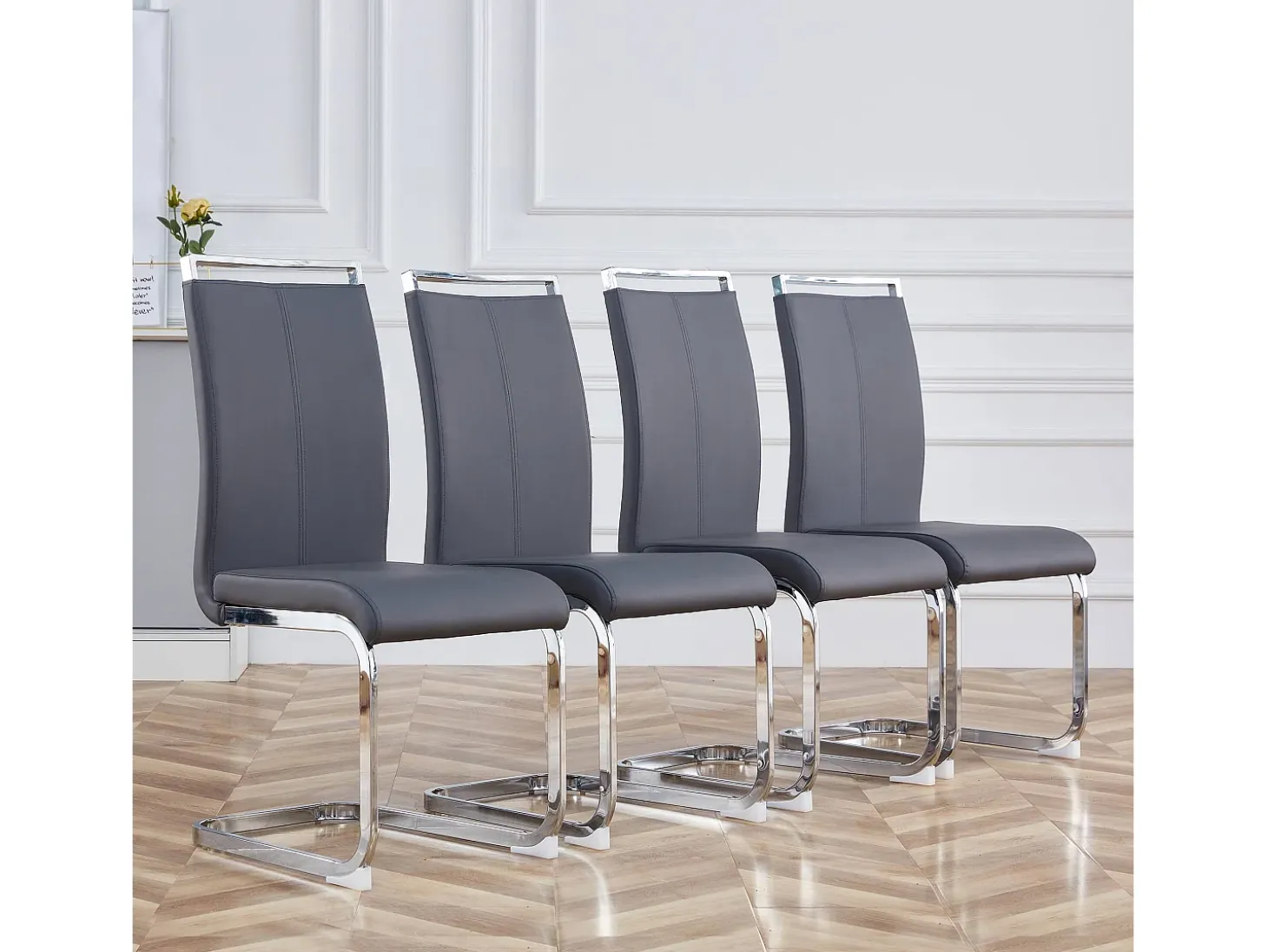 Juego de 4 sillas cantilever de PU gris con estructura de metal plateado