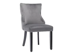 Juego de 4 sillas de terciopelo gris con patas de madera gris, botones decorativos y remaches plateados.
