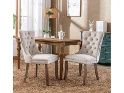 Juego de 2 sillas de terciopelo beige con capitoné y ribete tachonado, patas de madera