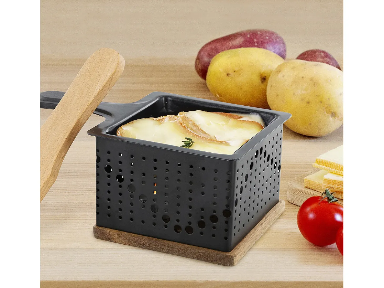 Raclette individual a la luz de las velas